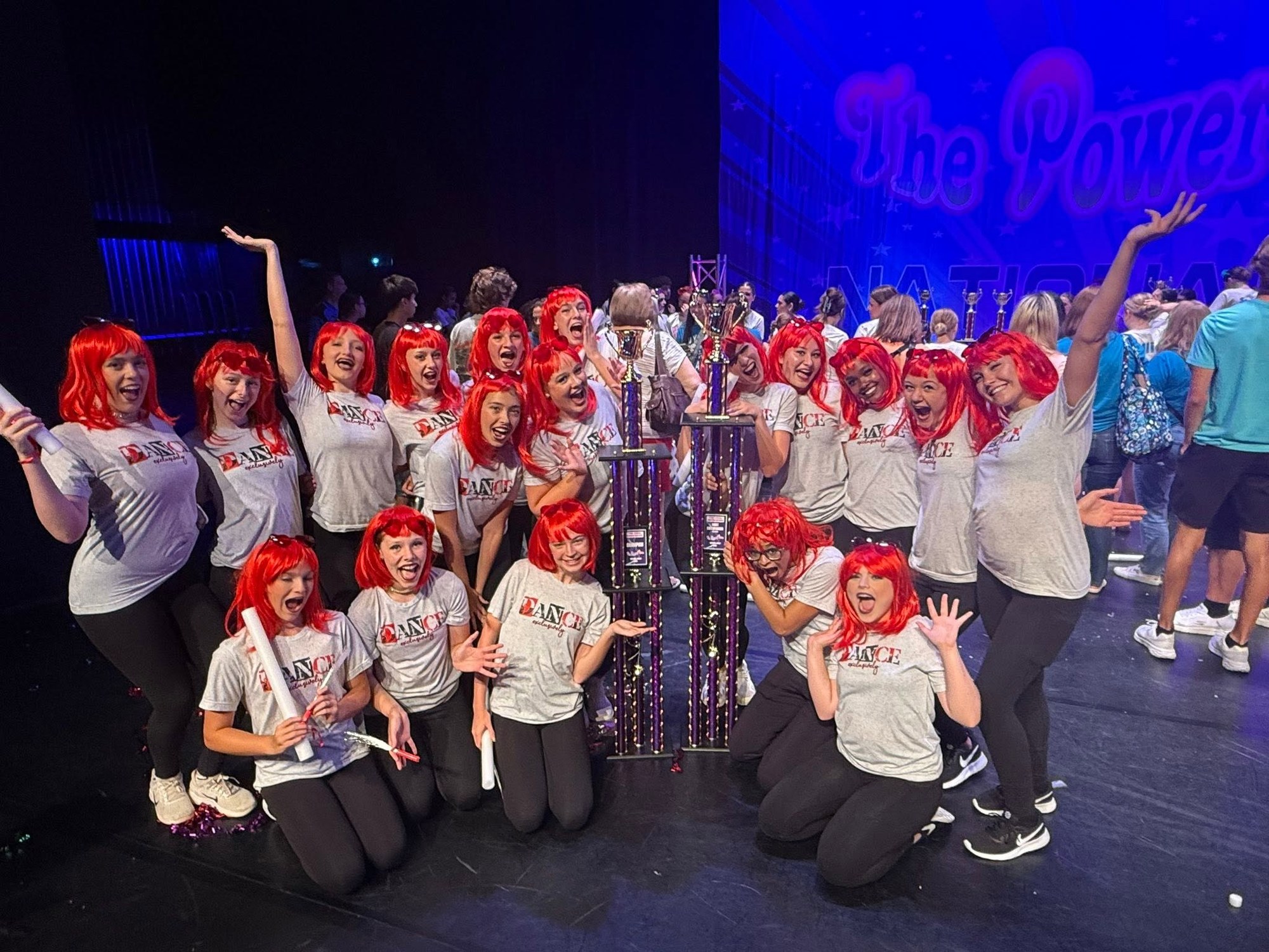 Exclusively Dance competitive dancers celebrating with trophies